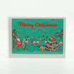 Merry Christmas Notecard with graphics of Santa and Flamingos on the beach