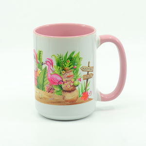 Santa Flamingo Beach Christmas graphics on a coffee mug