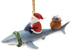 A resin Christmas ornament Santa on a shark