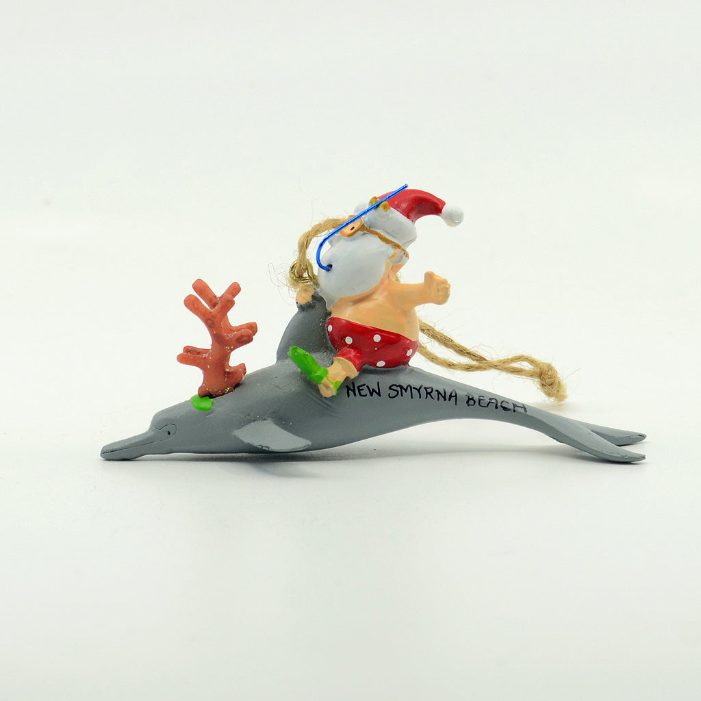 Santa riding a dolphin resin ornament