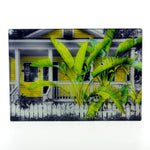A Florida Key's Cottage image on a rectangle glass cutting board
