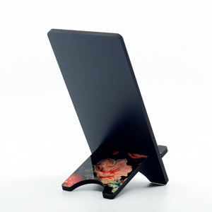 flamingo graphics on a phone stand