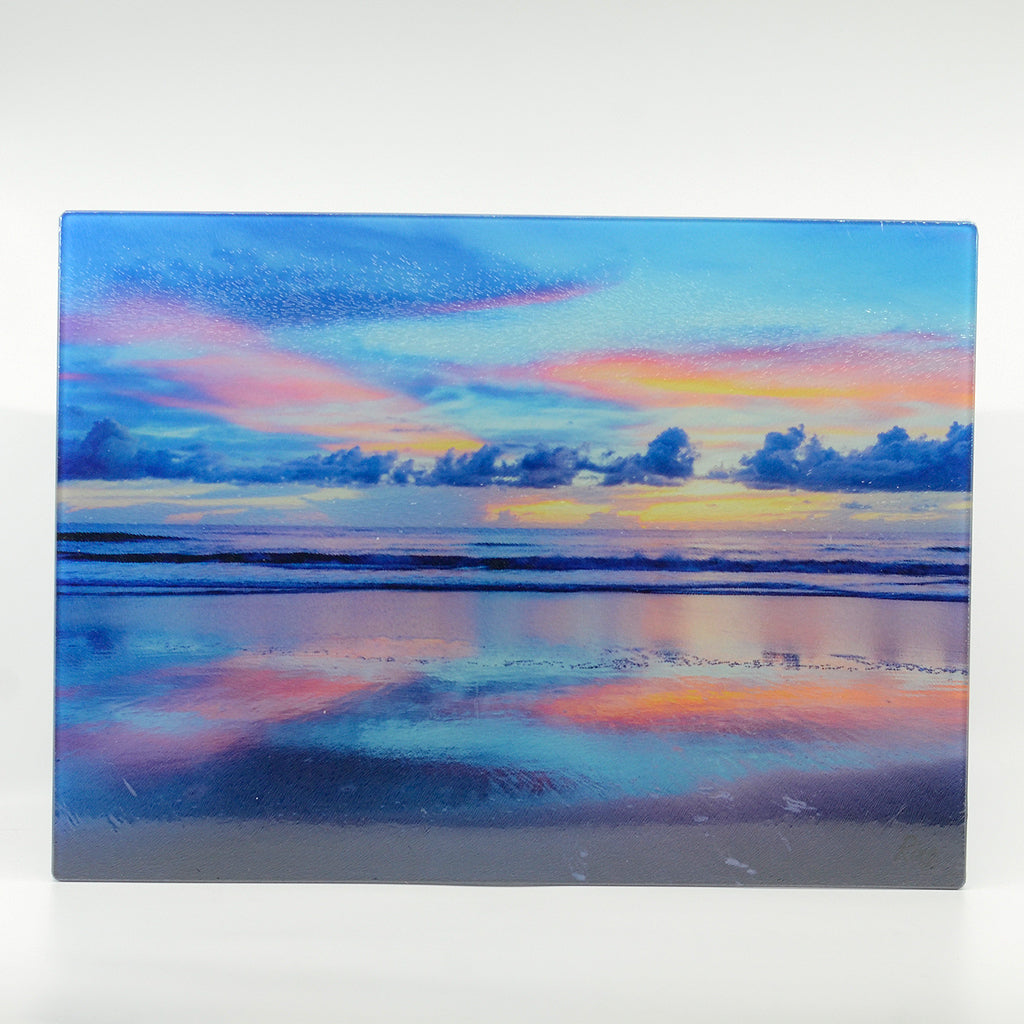 New Smyrna Beach Sunrise photograph on a glass cutting board