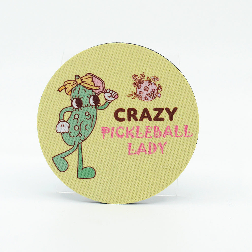 Crazy Pickleball lady graphics on a round rubber home coaster