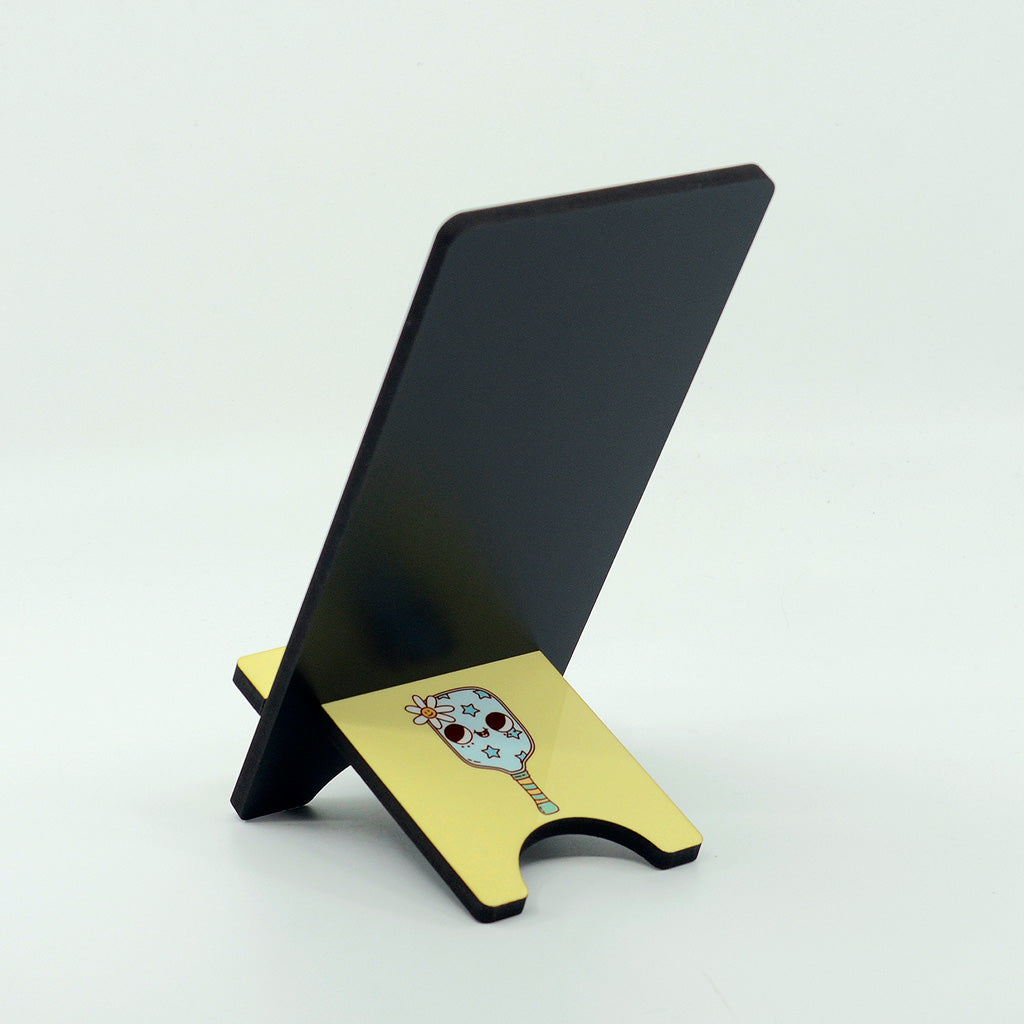 Crazy Pickleball Lady graphics on a phone stand