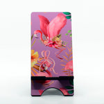 Purple Flamingo graphics on a phone stand