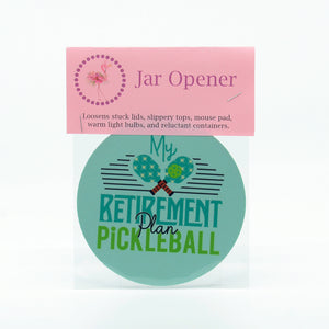 A ROUND RUBBER JAR OPENER WITH GRAPHICS OF PICKLEBALL RETIREMENT