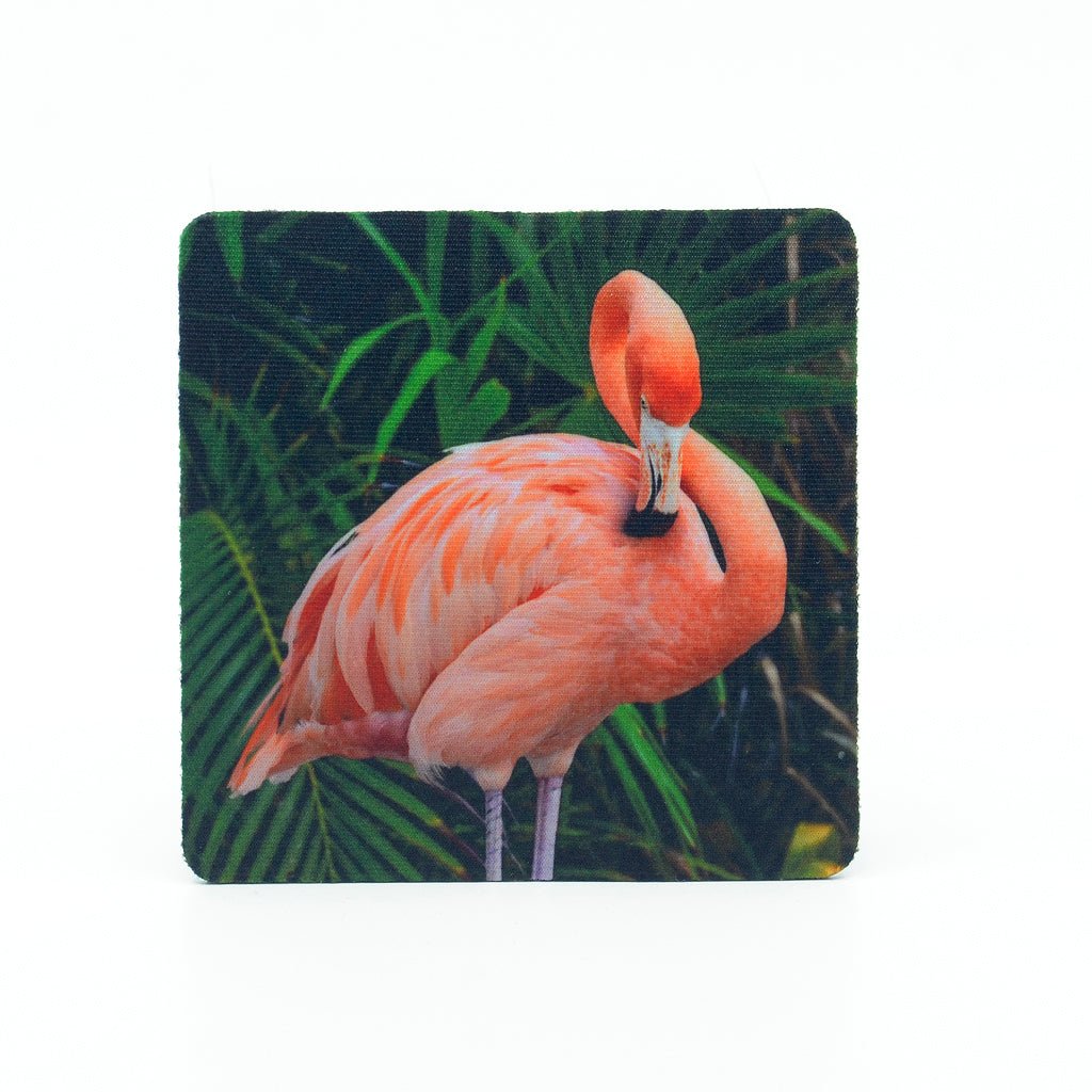 A photograph of flamingo on a square rubber home coaster