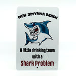 8"x12" aluminum street sign with artwork of Shark and words New Smyrna Beach-a little drinking town with a Shark Problem