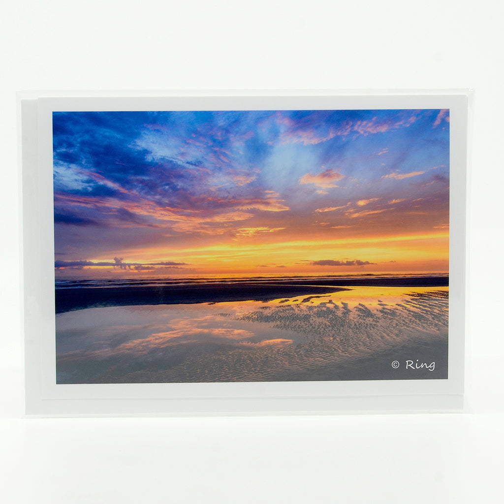 A view of the beach at sunrise on a 5"x7" glossy greeting card
