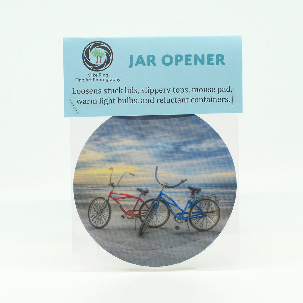 two beach cruisers on the beach on a 5" rubber bottle opener