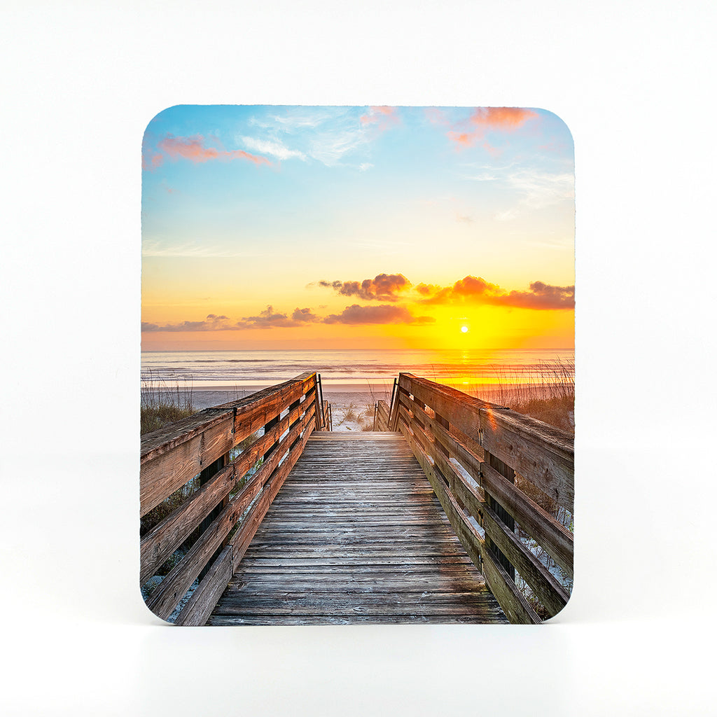 A boardwalk to the beach on a rectangle mouse pad