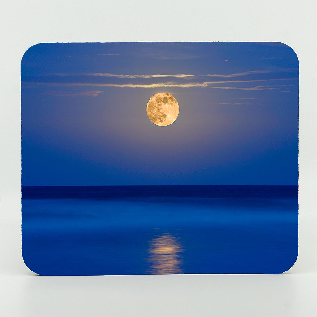 A super moon over the water photography on a rectangle rubber mouse pad