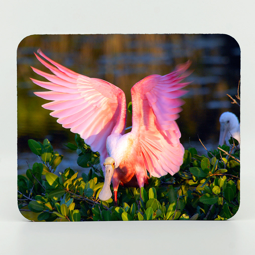 A roseate photograph on a rectangle rubber mouse pad