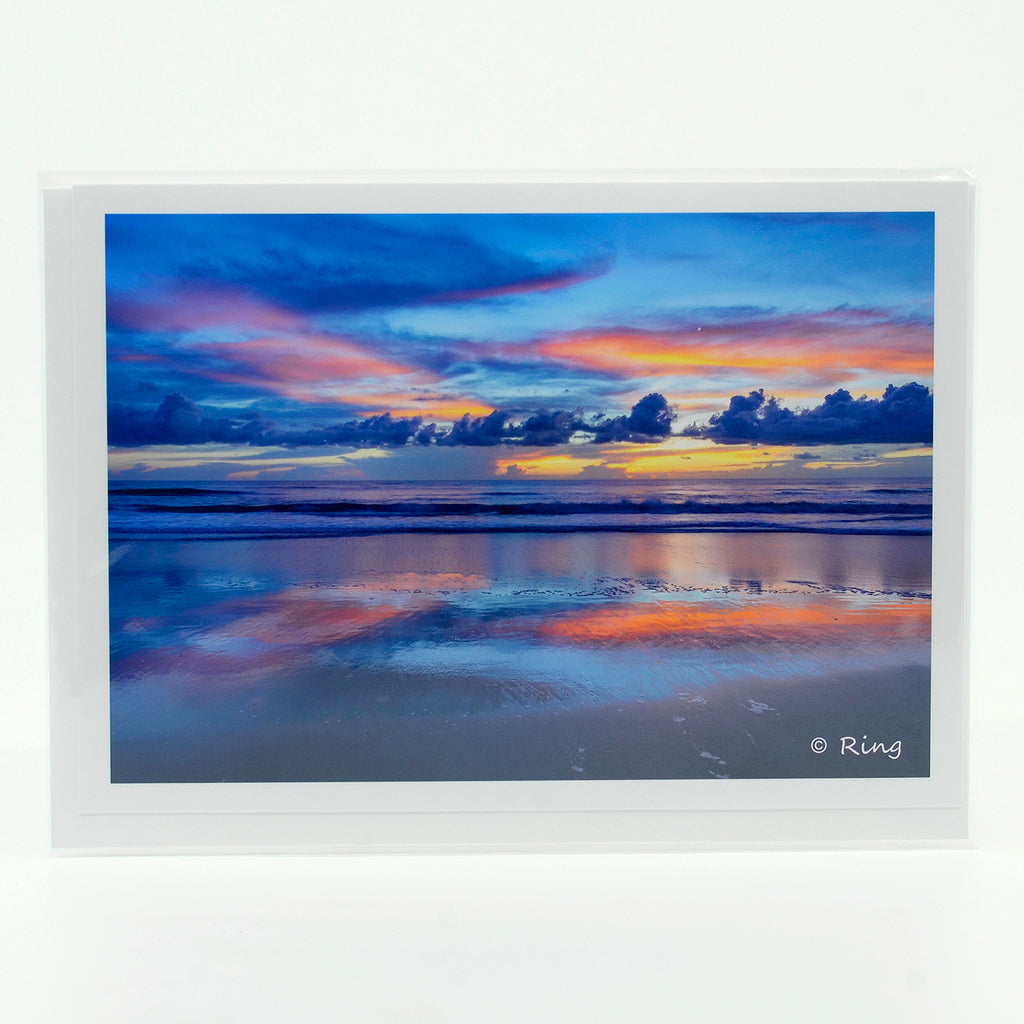 A view of the beach at sunrise on a 5"x7" glossy greeting card