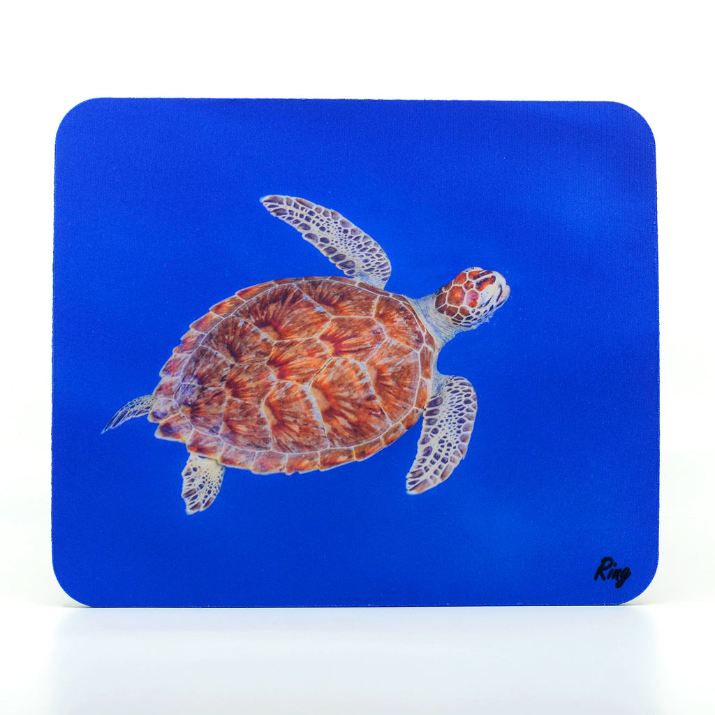 A beautiful green sea turtle swimming in the Caribbean Blue Water on a Rubber Mouse Pad