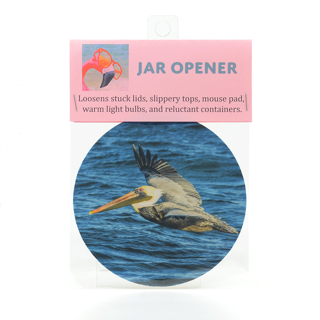 Flying Pelican over the ocean water on a rubber jar opener