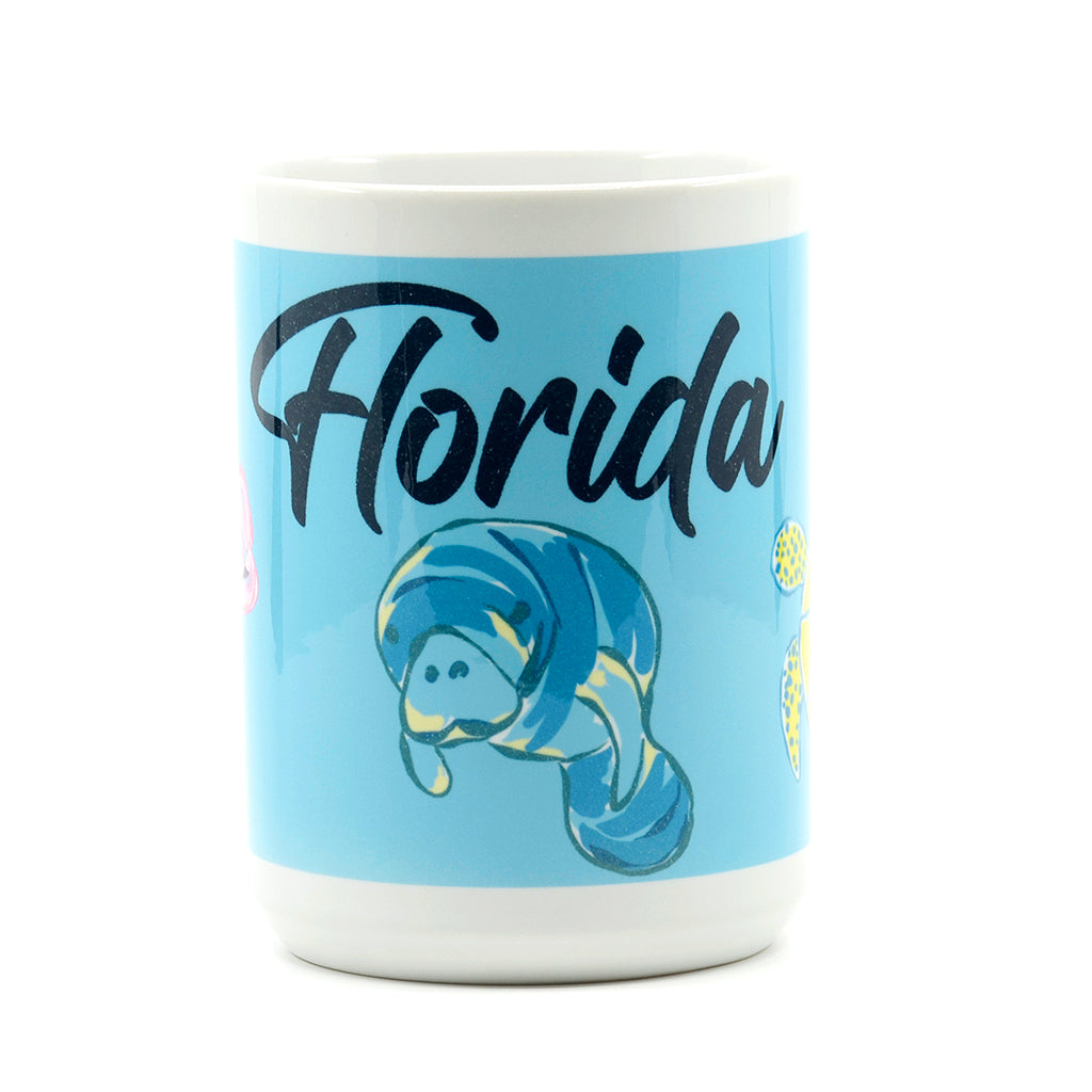 15 ounce white ceramic coffee mug wrapped with sea turtle, manatee and flamingo with words of Florida