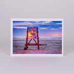 Notecard with Image of Life Guard Stand with Christmas Wreath Lighted on the Beach