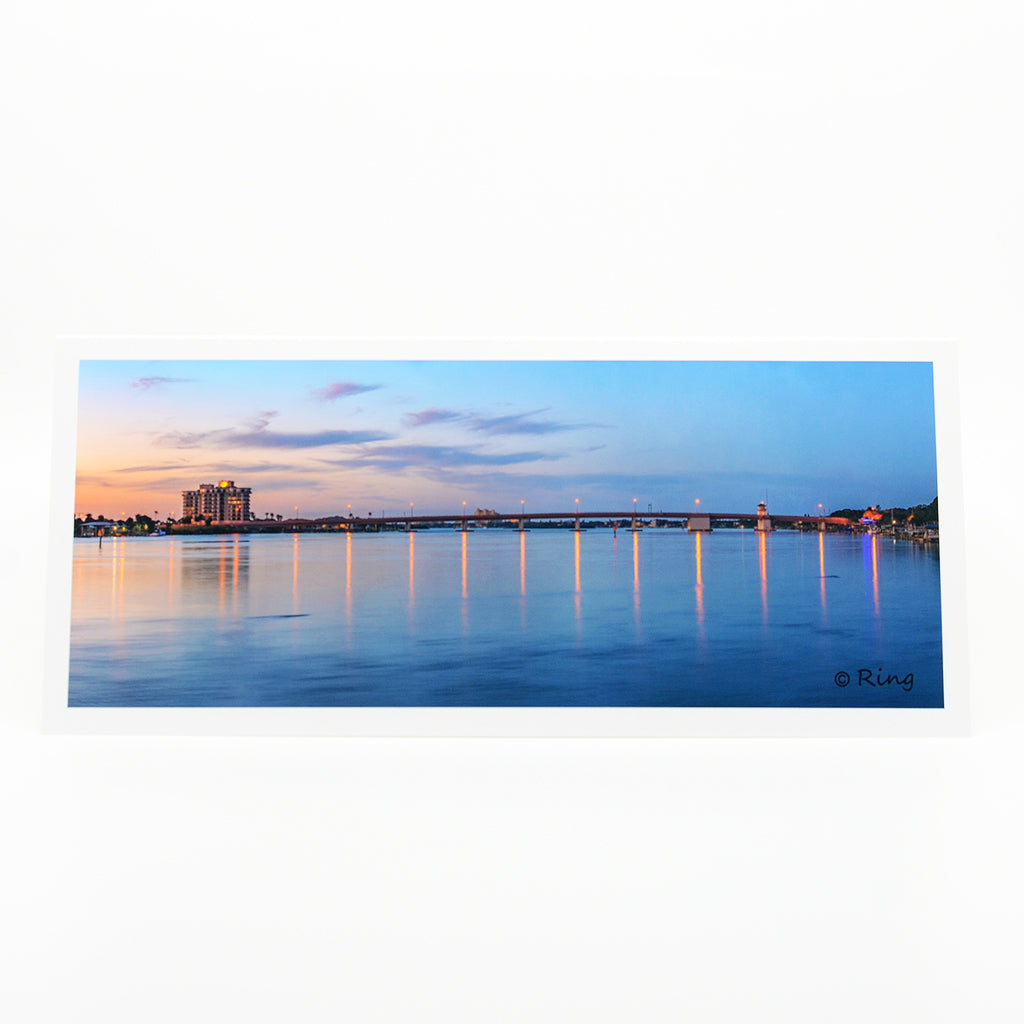"North Bridge" notecard.  A sunset view of the North Causeway bridge in New Smyrna Beach, Florida.  New Smyrna Beach is a boater paradise teeming with life.   This artwork is printed on an amazing quality notecard.